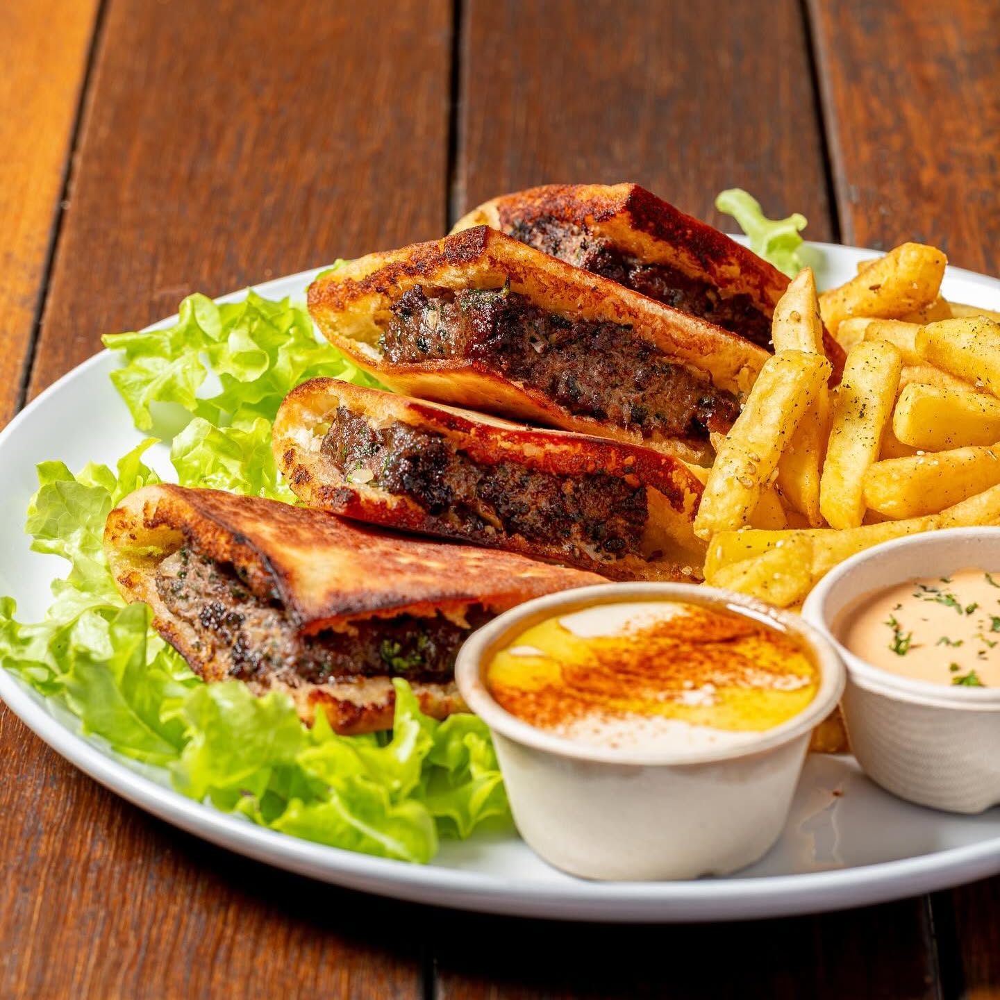 Beef Pita wedges with chips, hummus and chipotle sauce