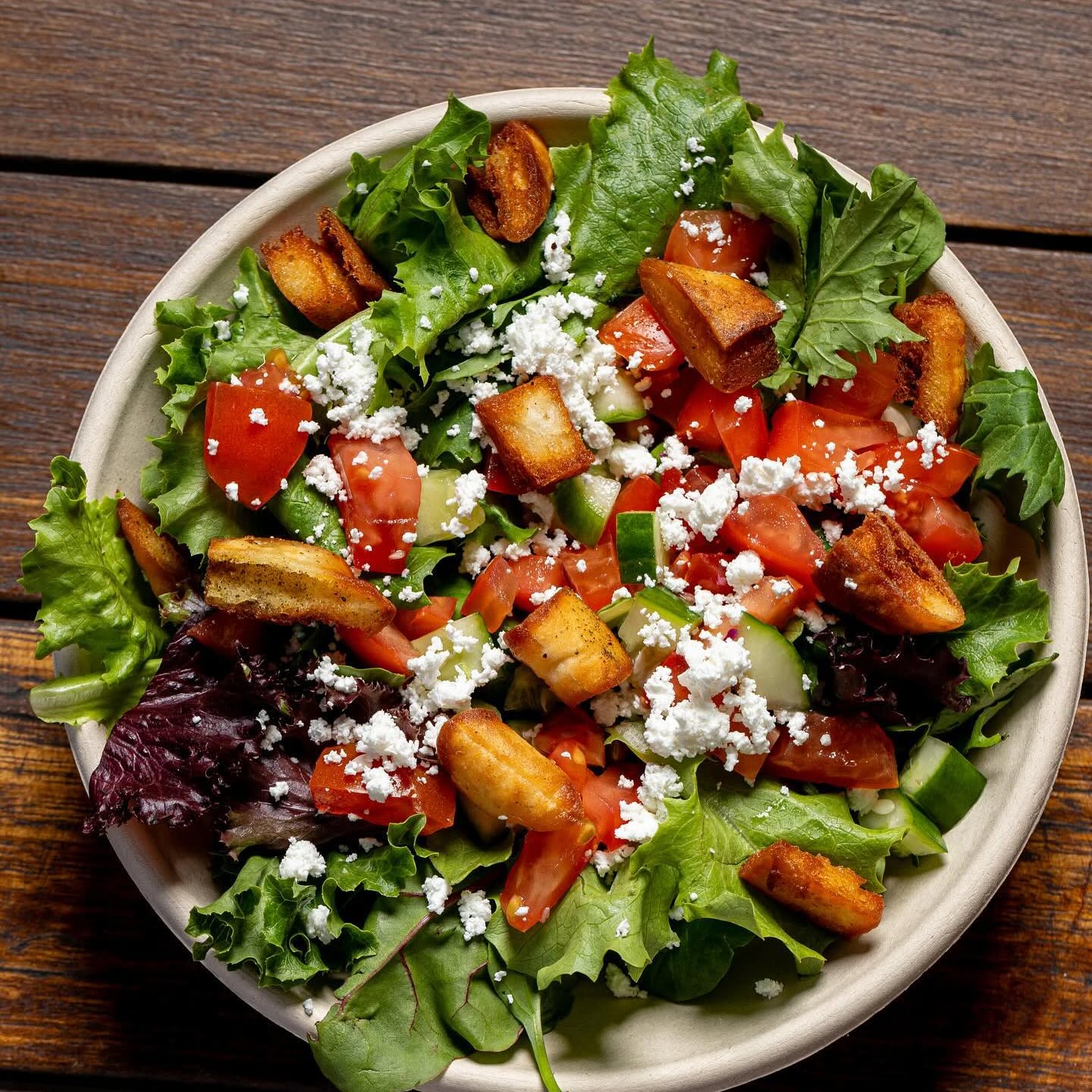 Salad bowl with feta, tomato, cucumber and fried pita chips